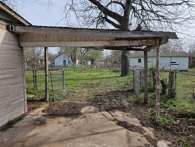 View of patio with fence