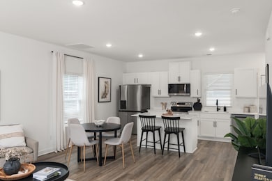 You will LOVE the open hosting space!! Photos of similar home.