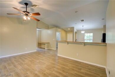Unfurnished room featuring baseboards, ceiling fan