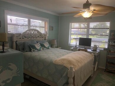 Bedroom 3 large view of water with queen size bed 