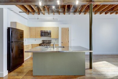 Kitchen with freestanding refrigerator, stainless