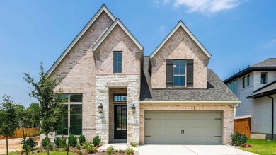 View of front facade featuring concrete driveway,