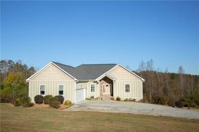 Two car garage with cement driveway.