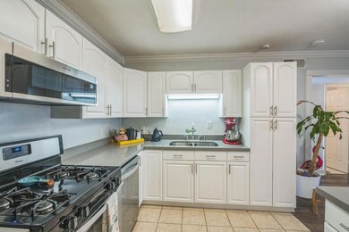 Kitchen with stainless steel appliances, crown mo