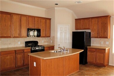 Kitchen includes granite counters