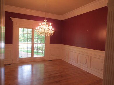Spacious Dining room with wainscoting.