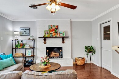 Family room featuring a wood-burning brick firepla