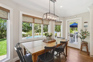 Casual dining overlooking yard & pool