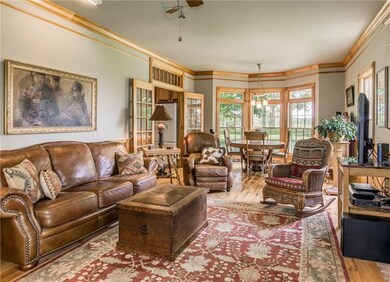 The living area is spacious with refinished hardwoods, crown mouldings, nine foot ceilings, and true bead board wainscoting. 