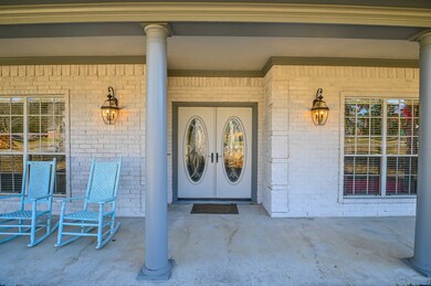 BEAUTIFUL DOUBLE FRONT DOORS WITH PORCH ON ENTIRE FRONT!