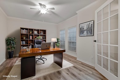 Office area featuring crown molding, ceiling fan, 