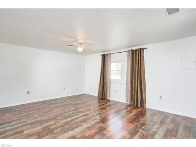 Family room with new LVT and window treatments