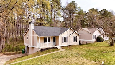 View of front of house with board and batten sidin