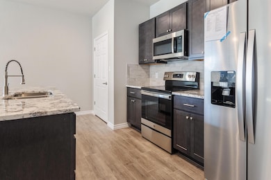 Kitchen featuring appliances with stainless steel