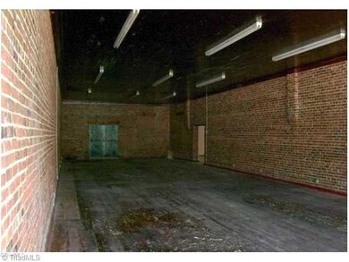 Interior Space/Layout. Unit 2 - Open area. Brick walls. Wood floors. Tongue-in-groove ceiling. Back loading doors. Connected to Unit 1 - back offices.