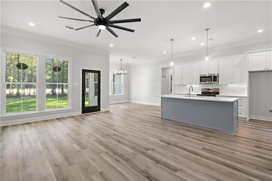 Living Room with wall of windows overlooking backy