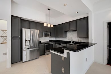 Generous kitchen with stainless appliances ready t