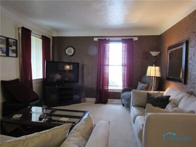 Living room leads into den area.