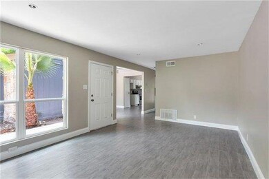 Empty room with baseboards and wood finished floo