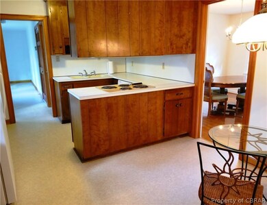 Kitchen offers breakfast area and access to dining