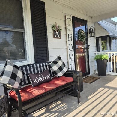 Doorway to property with covered porch