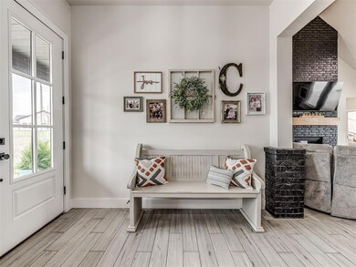 As guests enter they see through the living room & out the large windows overlooking the back property & beyond.