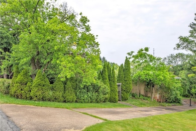 Concrete Driveway to Right of the Home, Leads to G