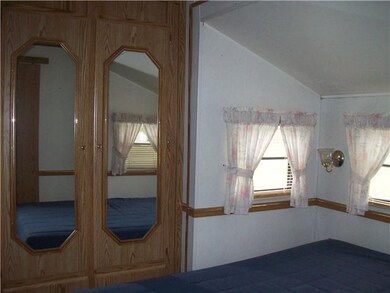 Bedroom. Mirrored doors on closet. Bedroom will ho