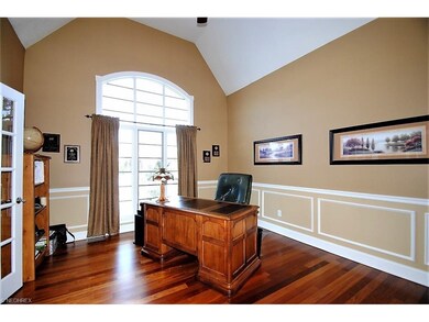 French doors off the foyer open to a sophisticated