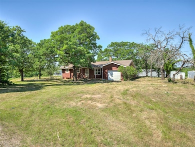 View of yard with an attached garage
