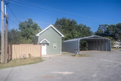 Garage featuring a carport