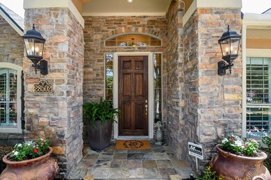 Covered front porch with tiled front porch.