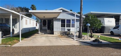 Manufactured / mobile home featuring a carport