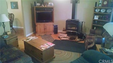 Living Room with Oak Hardwood floors and a wood st