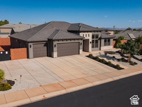 Prairie-style house with an attached garage and concrete driveway