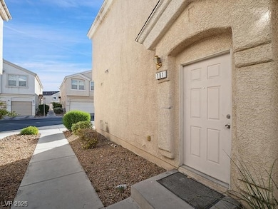 Property entrance featuring stucco siding