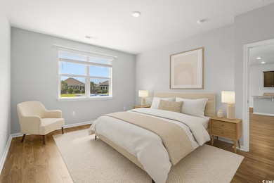 Bedroom featuring wood finished floors and recessed lighting