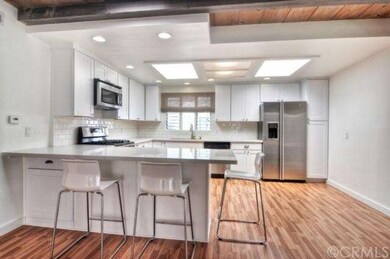 Spacious remodeled kitchen features quartz counter