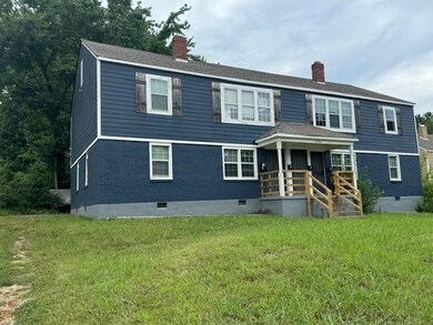 View of front of house with a front yard