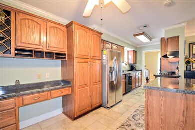 Kitchen and built in desk, island on moveable righ