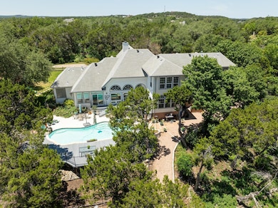 Aerial view of property and surrounding area with