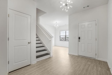 Foyer and view into the Dining/Sitting Room