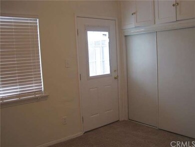 Second bedroom opening to rear yard