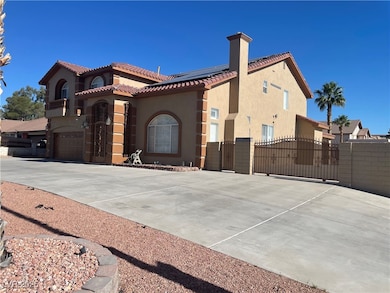 View of property exterior with a gate, a tile roof