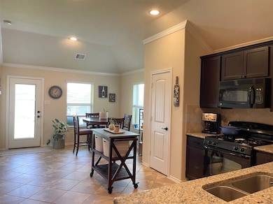 Kitchen open to breakfast area