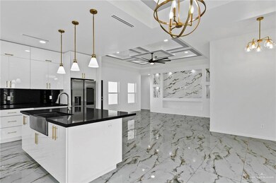 Kitchen featuring a sink, visible vents, recessed lighting, stainless steel fridge with ice dispenser, and modern cabinets