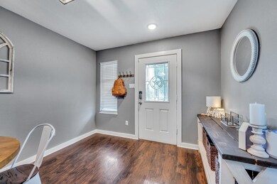 Foyer with dark hardwood / wood-style floors