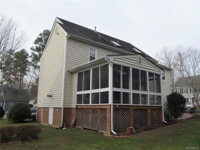 Rear screened porch with storage below