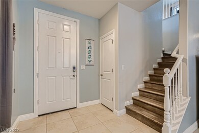 Foyer with 18x18 Tile flooring & two tone paint.