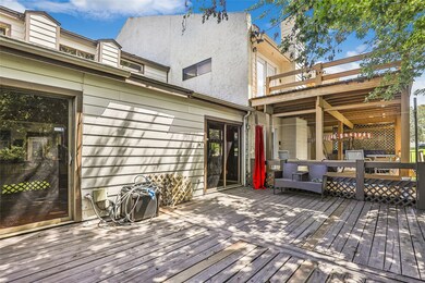 This home features a spacious wooden deck, perfect